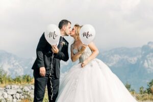 man and woman taking wedding photos